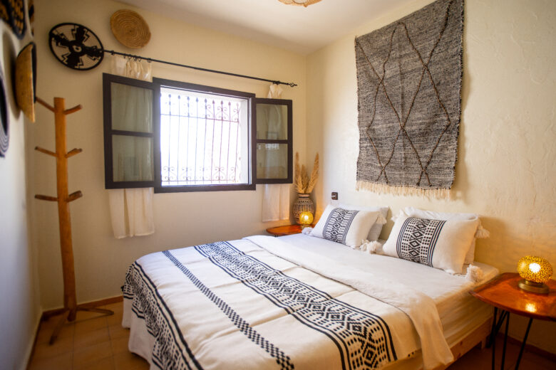 double room with wall decorations and double bed