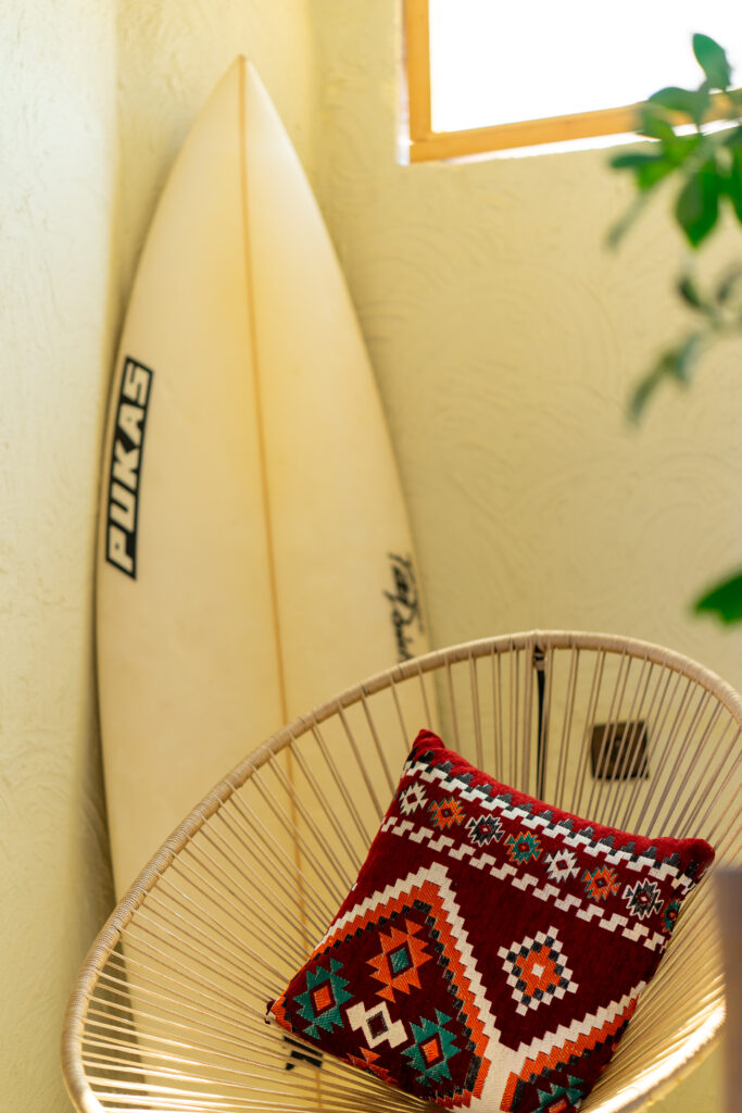 comfy chair with surfboard decoration at anza surfhouse