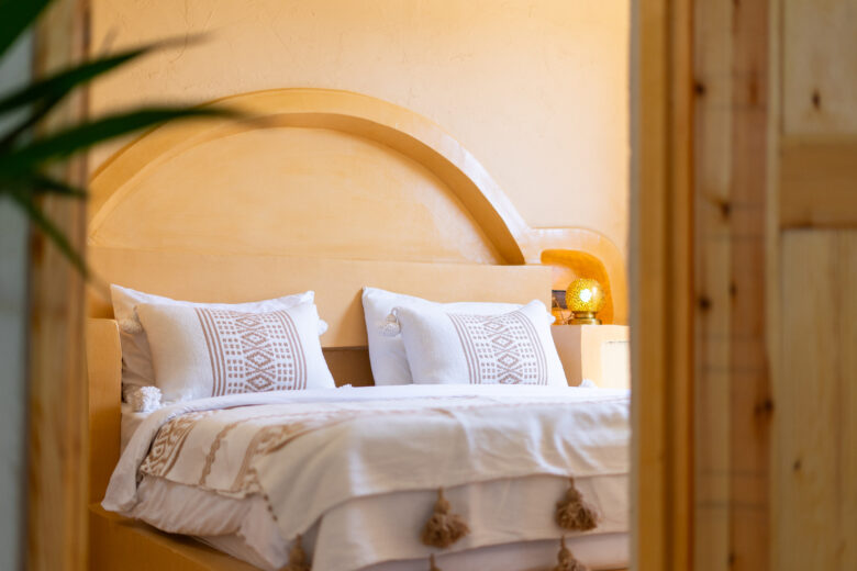 double room; view from outside the room with palmtree shadows